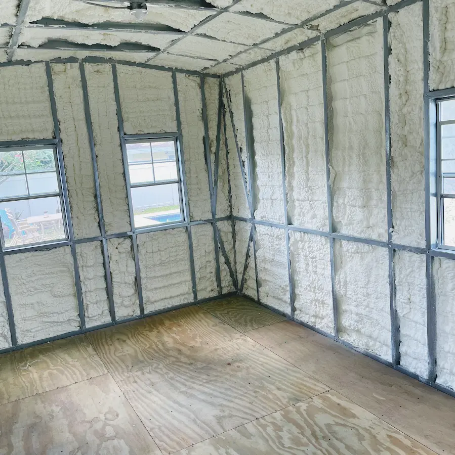 Closed-cell spray foam insulation applied to wall cavities in a residential project in Durham